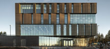 Modern façade of the Québec City Police Station, a six-story building featuring STE-6000 curtain walls and sleek contemporary cladding.